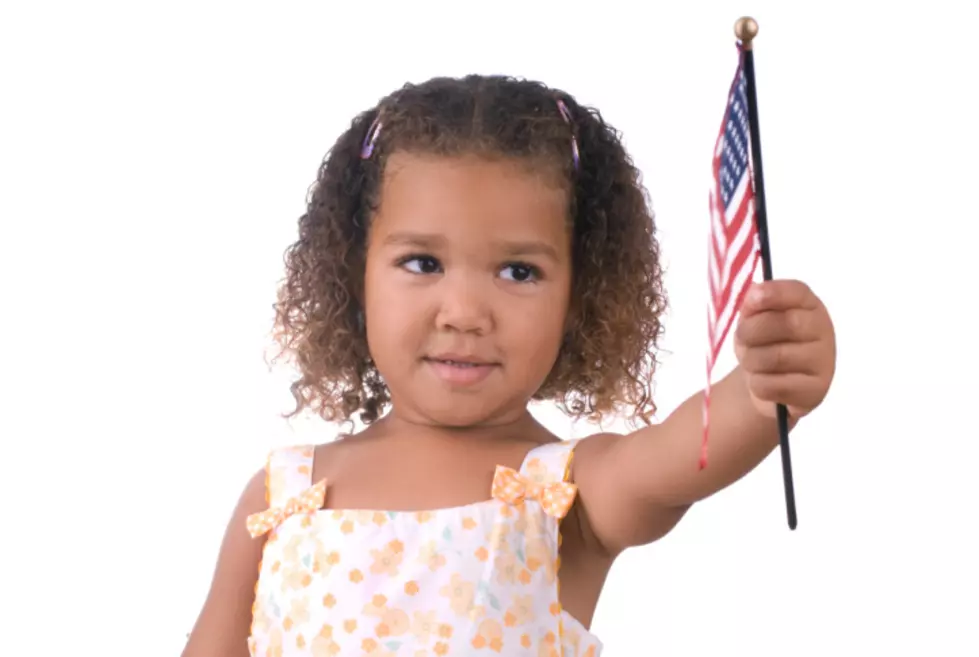 Girl holding American flag